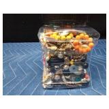 Jar of jewelry and jewelry pieces
