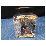 Jar of jewelry and jewelry pieces