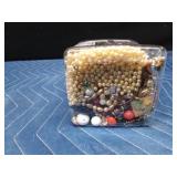 Jar of jewelry and jewelry pieces