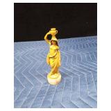1920's or 1930's Celluloid lady carrying water on a marble base