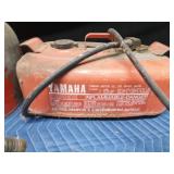 2 metal gas cans and 1 Yamaha boat gas tank