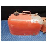 2 metal gas cans and 1 Yamaha boat gas tank