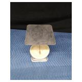 Metal scale with plastic face covering