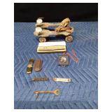 Vintage items including Marlboro lighter and Grain Belt bottle opener