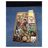 Flat of jewelry, earring holder, and candle