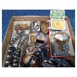 Flat of jewelry, earring holder, and candle