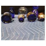 Blue glassware and 2 candlestick holders