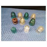 8 Glass insulators and 1 brown ceramic