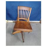 Vintage solid wood adjustable office chair on wheels