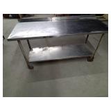 Stainless steel shop table on wheels with bottom shelf
