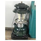 2 - Coleman Lanterns with Cases - 1 is gas and the other is propane