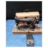Antique Singer sewing machine in rounded top case