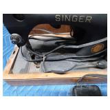 Antique Singer sewing machine in rounded top case
