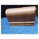 Antique Singer sewing machine in rounded top case