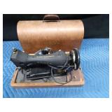 Antique Singer sewing machine in rounded top case