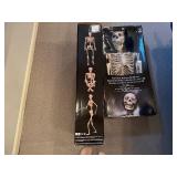 Two Pose-N-Stay Skeleton's with LED Eyes 60' Tall