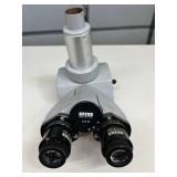 MSRP $1,200 Zeiss 473028 Trinocular Head. This microscope attachment lets you view samples with both eyes while a camera port records images. Perfect for classroom sharing and high-quality photo docum