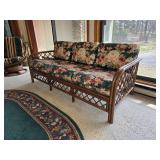 Rattan Frame Sofa with Floral Upholstery Cushions