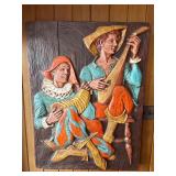 This vintage mid-century modern 3D wall sculpture, titled 'Jesters and Clowns' or 'Renaissance Minstrels,' is a fiberglass art piece by the artist J. Segura
