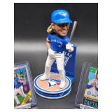Vladimir Guerrero Bobblehead with a Limited 69/99 2021 Topps Baseball Card and a 2023 Topps Chrome Baseball Card