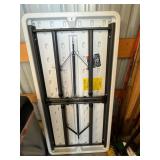 Lifetime Folding Table with Yard Tools - Garage Storage