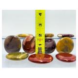 Mookaite Jasper is a unique Australian gemstone formed from ancient fossilized sea creatures that is prized by collectors for its vibrant, porcelain-like colors found in both raw slabs and smooth palm