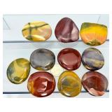 Mookaite Jasper is a unique Australian gemstone formed from ancient fossilized sea creatures that is prized by collectors for its vibrant, porcelain-like colors found in both raw slabs and smooth palm
