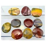 Mookaite Jasper is a unique Australian gemstone formed from ancient fossilized sea creatures that is prized by collectors for its vibrant, porcelain-like colors found in both raw slabs and smooth palm