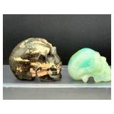Lot of 2 Hand-Carved Crystal Skulls: Rhodonite & Caribbean Calcite