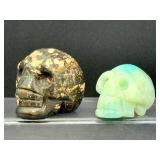 Lot of 2 Hand-Carved Crystal Skulls: Rhodonite & Caribbean Calcite