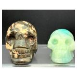 Lot of 2 Hand-Carved Crystal Skulls: Rhodonite & Caribbean Calcite