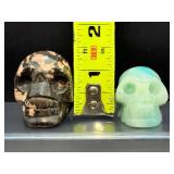 Lot of 2 Hand-Carved Crystal Skulls: Rhodonite & Caribbean Calcite