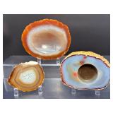 Hand-Carved Agate Geode Candle Holder – Vibrant Red & Blue Banding. Polished Agate Trinket Dish – Warm Amber & Cream 'Fortification' Agate. Large Brazilian Agate Display Slab – Fiery Ora