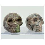 Rare 2pc Lot Hand-Carved Gemstone Skulls: Fluorescent Yooperlite & Vibrant Dragon’s Blood Jasper – UV Reactive Specimen Set