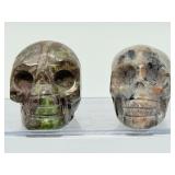 Rare 2pc Lot Hand-Carved Gemstone Skulls: Fluorescent Yooperlite & Vibrant Dragon’s Blood Jasper – UV Reactive Specimen Set