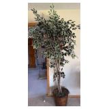 Artificial tree in pot with birds in the leaves