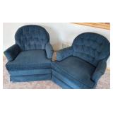 two blue upholstered barrel styled chairs