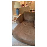 Suede style material Chase lounge with end table and blue lamp