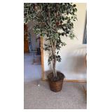 Artificial tree in pot with birds in the leaves