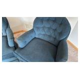 two blue upholstered barrel styled chairs