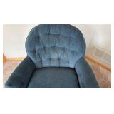 two blue upholstered barrel styled chairs