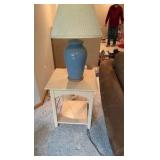Suede style material Chase lounge with end table and blue lamp