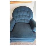 two blue upholstered barrel styled chairs