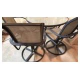 Glass top patio set with four chairs