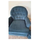 two blue upholstered barrel styled chairs