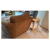 Suede style material Chase lounge with end table and blue lamp