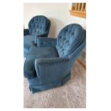 two blue upholstered barrel styled chairs