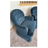 two blue upholstered barrel styled chairs