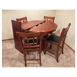 Cherry Finish Round Extension Dining Table with 4 Cushioned Chairs