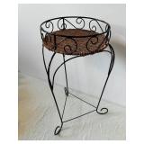 Variegated Faux Pothos Plant in Wicker Basket on Black Metal Plant Stand